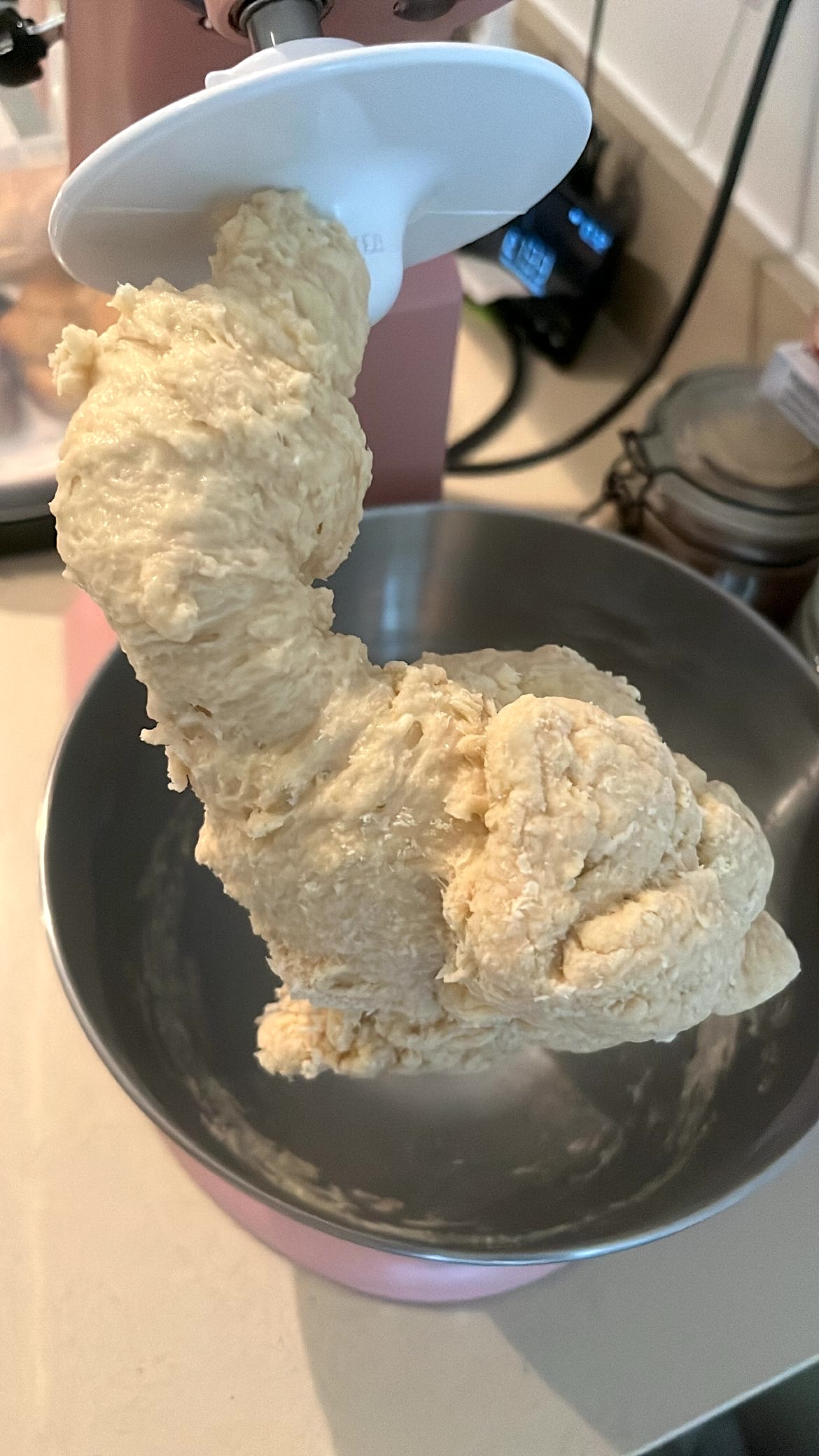 Dough in the kneading process with butter ready to be added