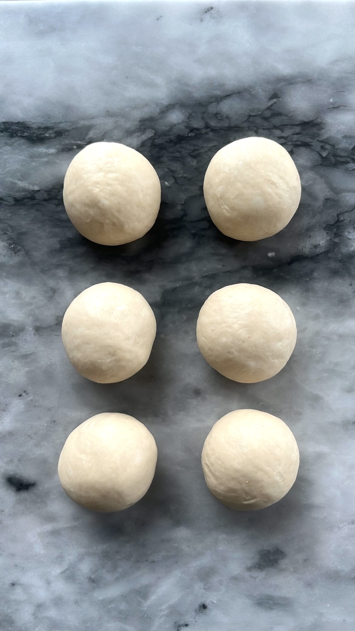 Small round dough portions resting for 15 minutes