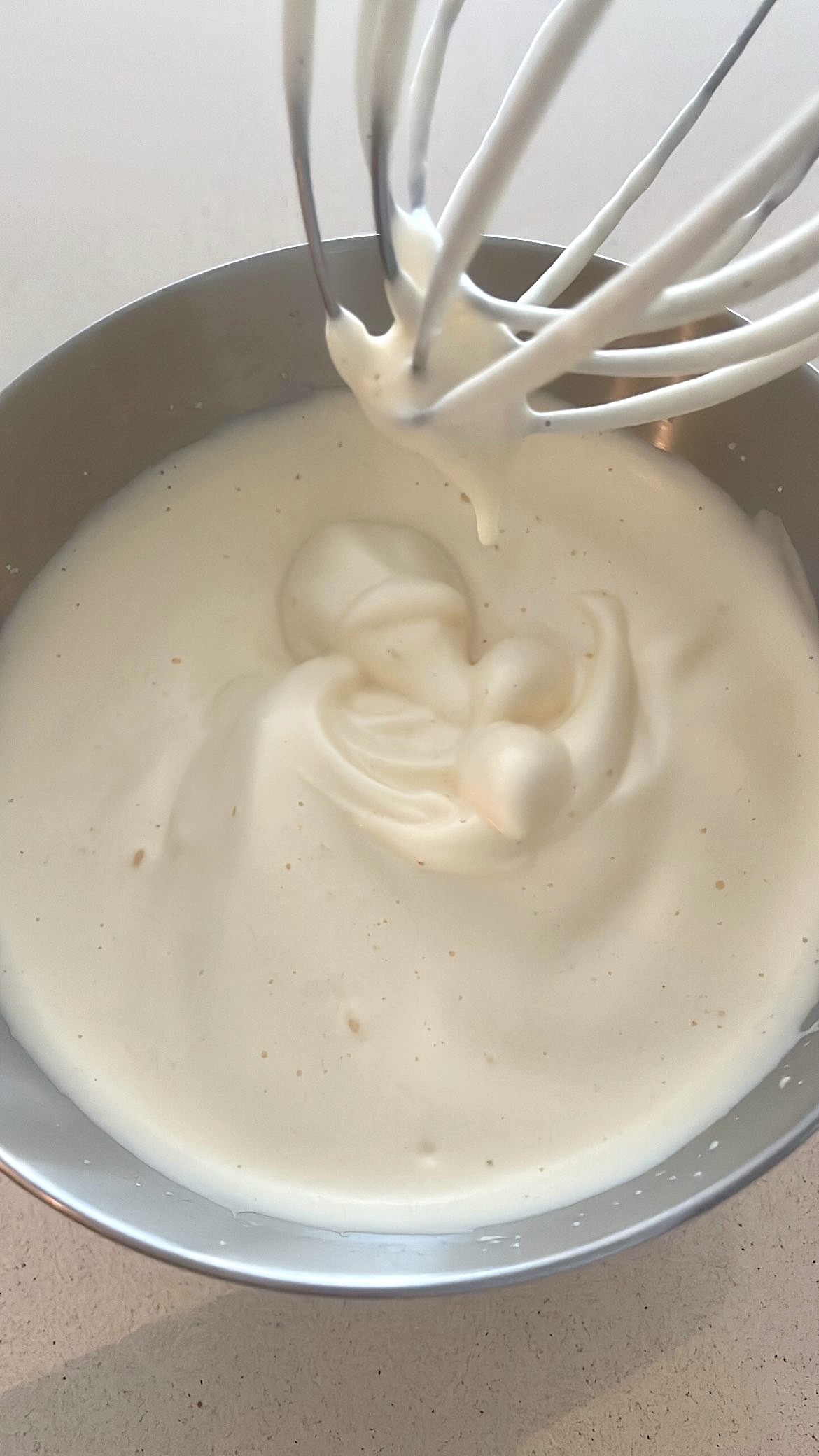 Whipped egg mixture that holds a ribbon pattern