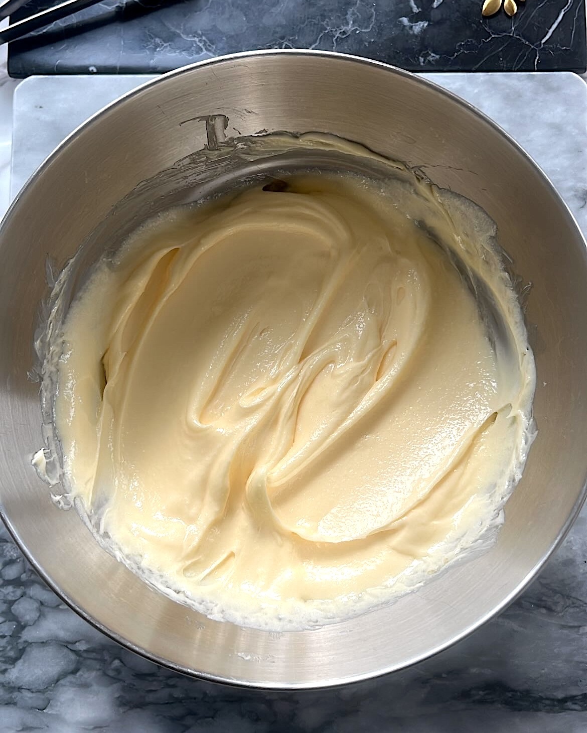 Butter and sugar creamed together in a bowl