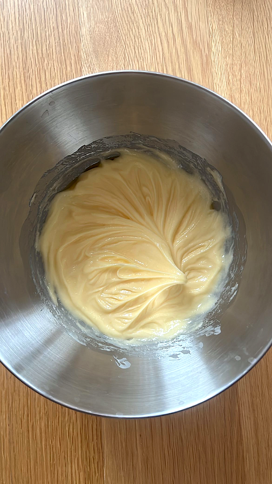 Butter and sugar mixture with egg being added