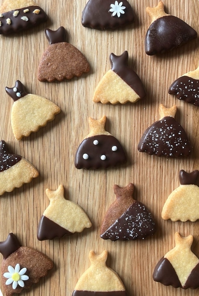 Cookie in dress shape with various chocolate decoration