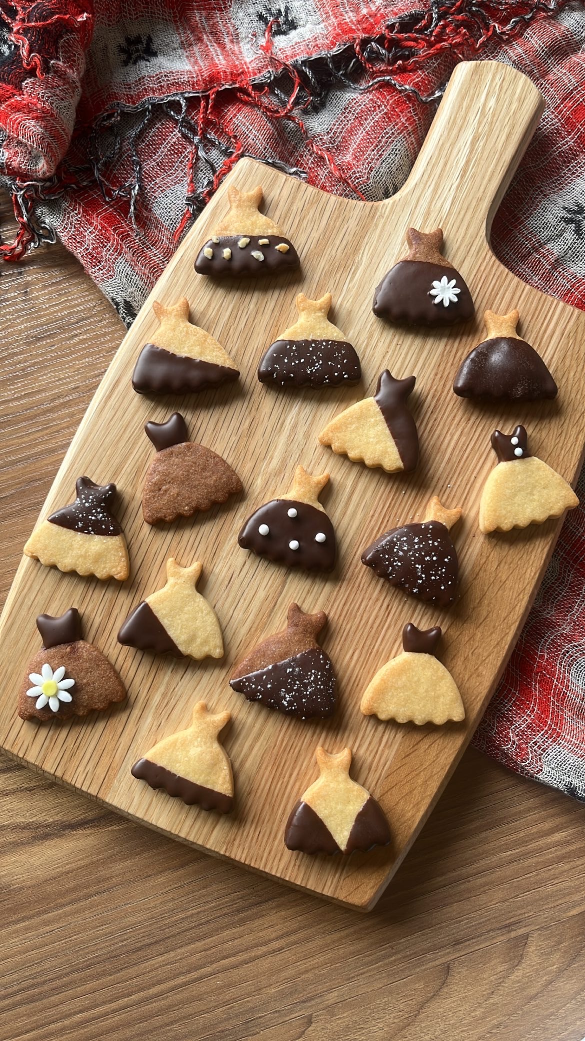 Cookie in dress shape with various chocolate decoration