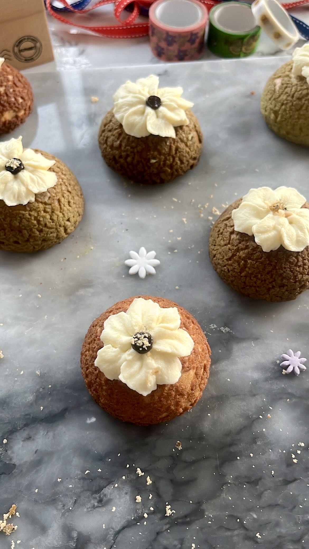 Choux pastry decorated with cream piping on top