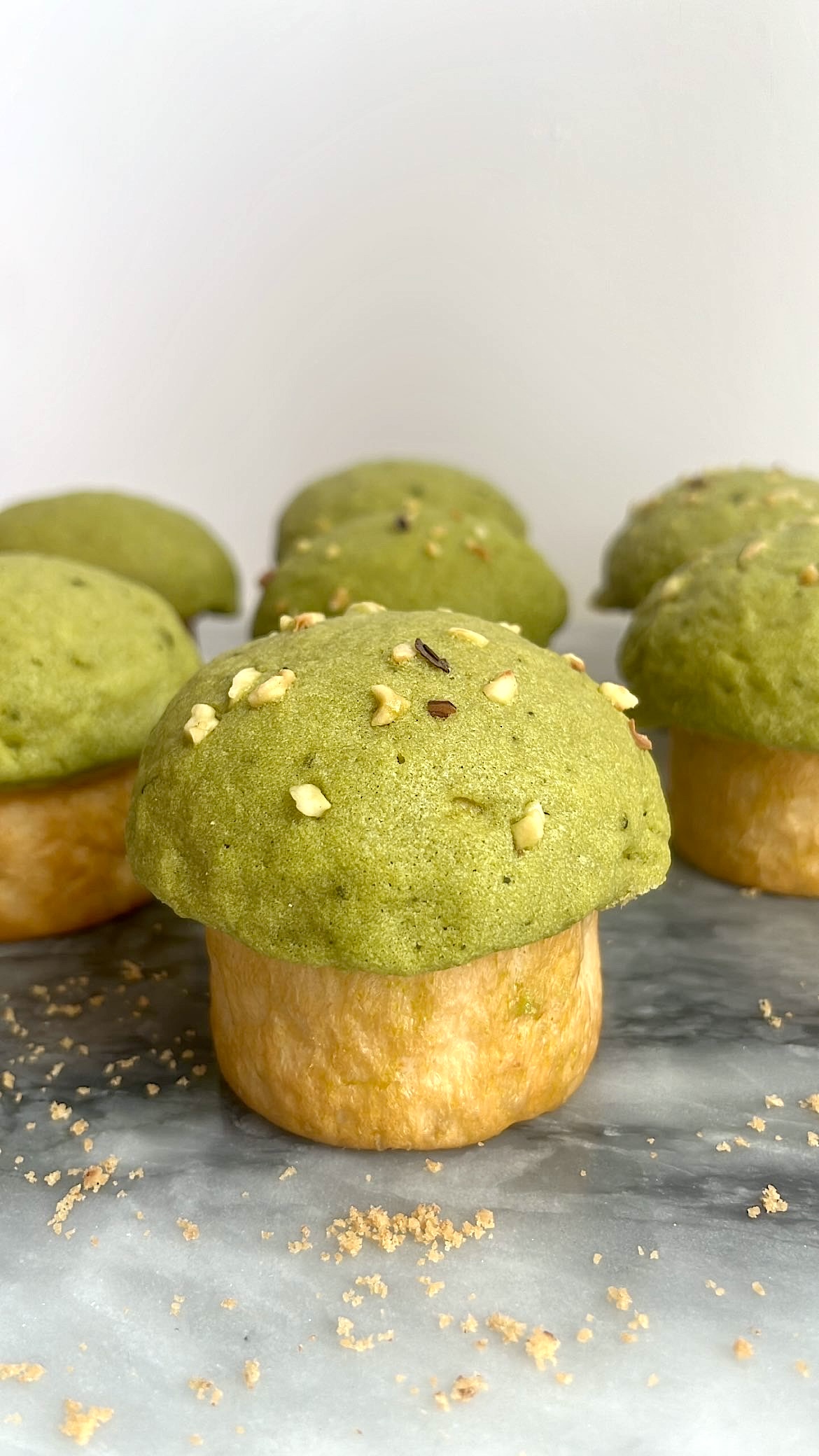 Bread with a crispy matcha top shaped like a mushroom, linking to Matcha Mushroom Bread recipe